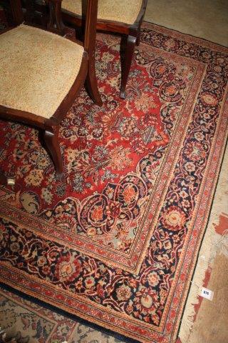 Heriz red ground carpet, with central dark medallion and border, 140 x 74in